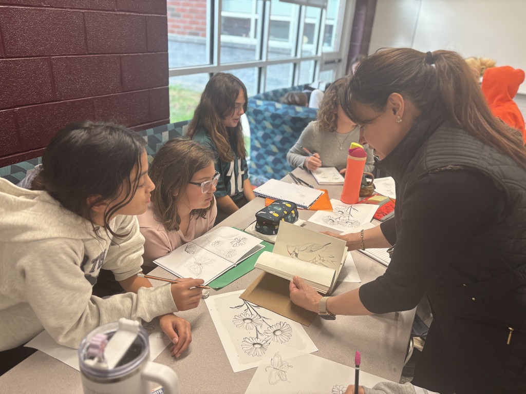 Students participate in an afterschool art club.