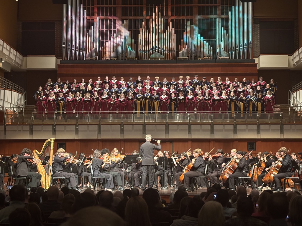 A photo from the audience of a musical collaborative on stage.
