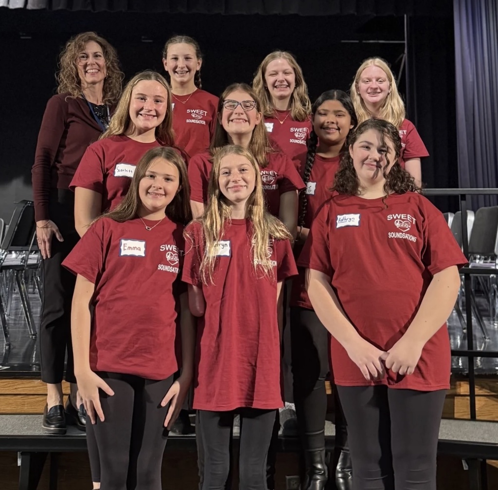 A group of girls preparing to sing in a choir festival.