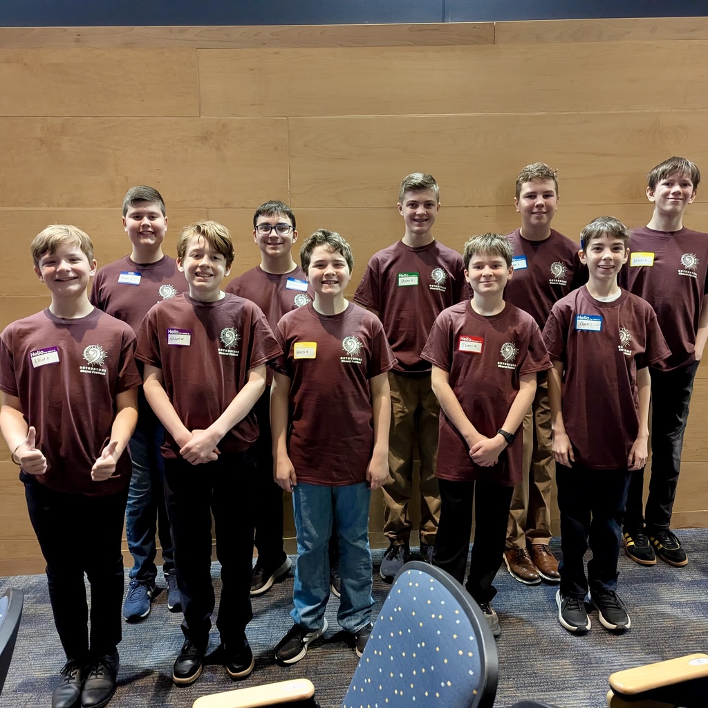 A group of boys preparing to sing in a choir festival.