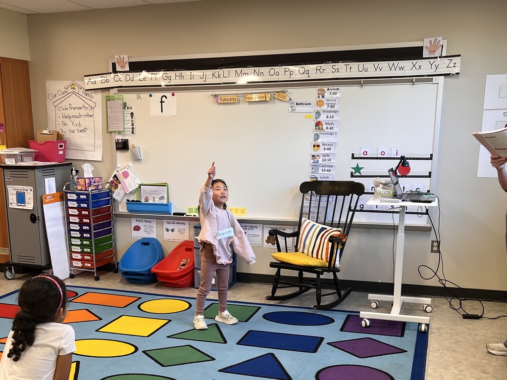 A young student acting out a folktale.