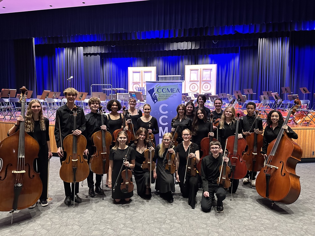 A group of students musicians with their instruments.