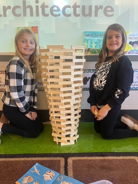 Two young students with building blocks.