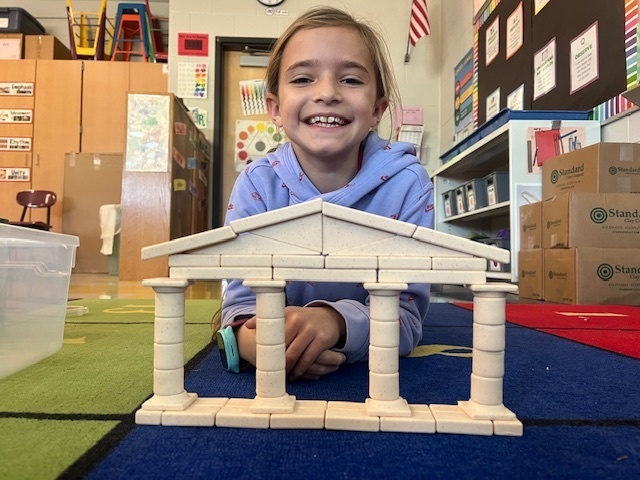 A young student with building blocks.