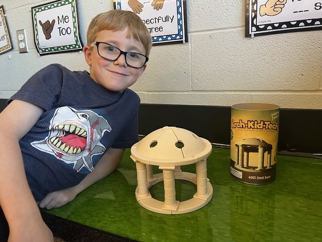 A young student with a building blocks.