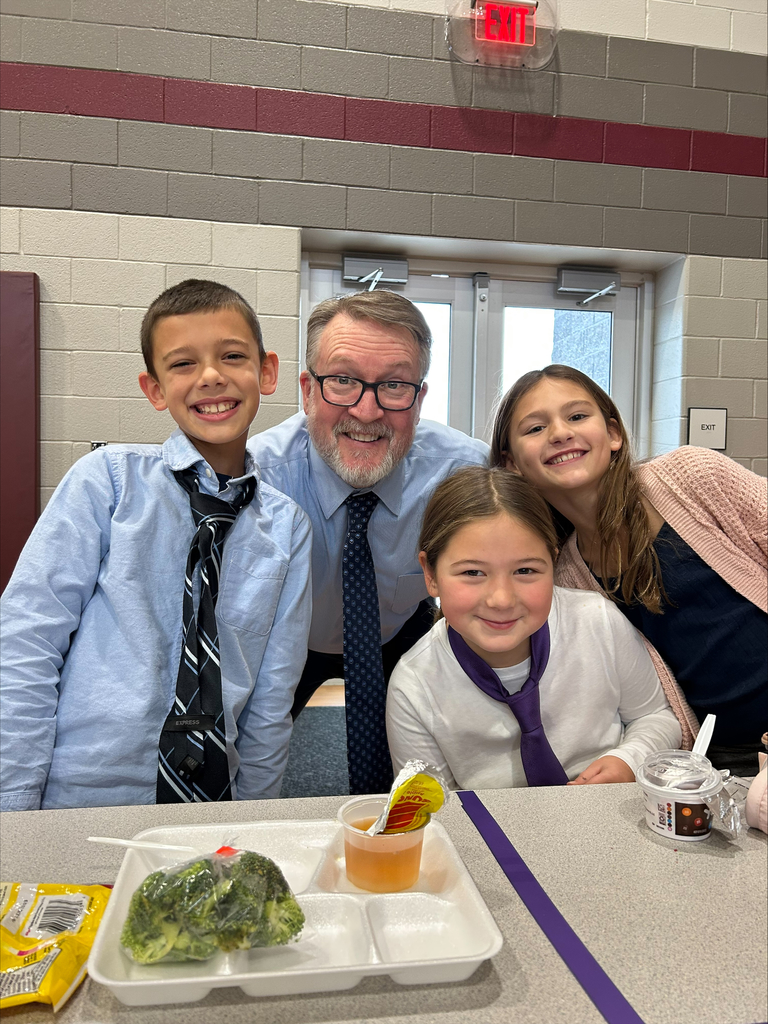 Students dressed in shirts and ties like their principal.