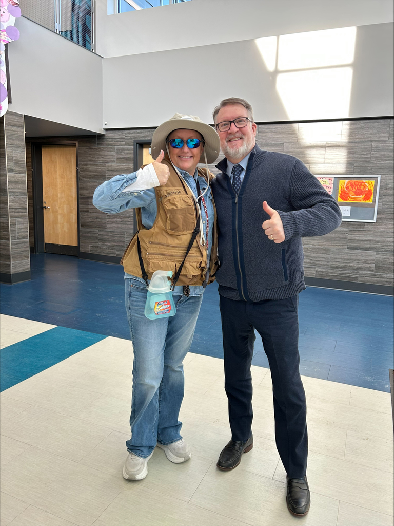 Students dressed in shirts and ties like their principal.