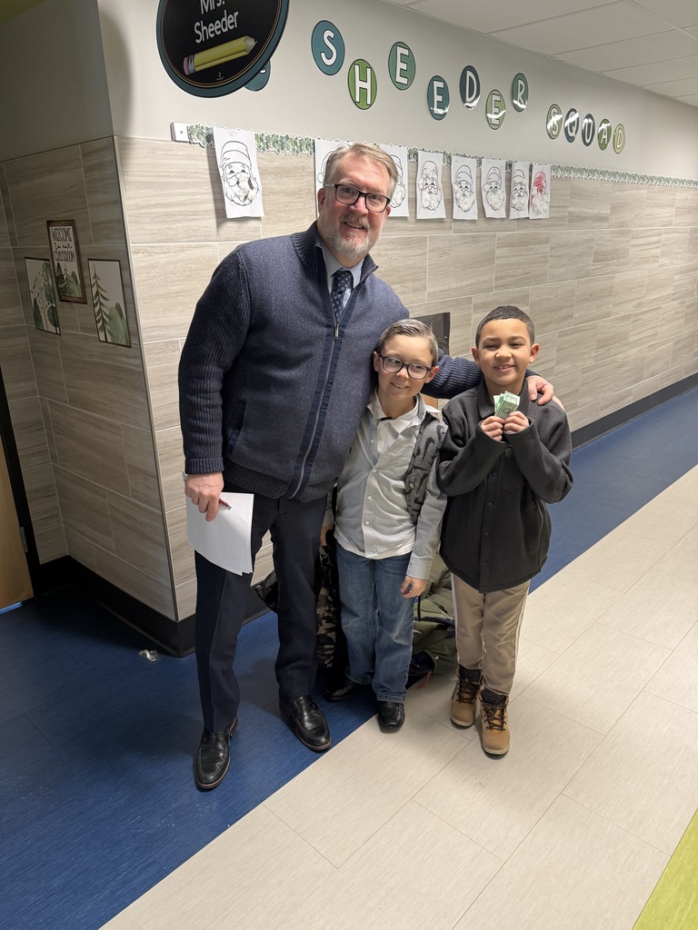 Students dressed in shirts and ties like their principal.
