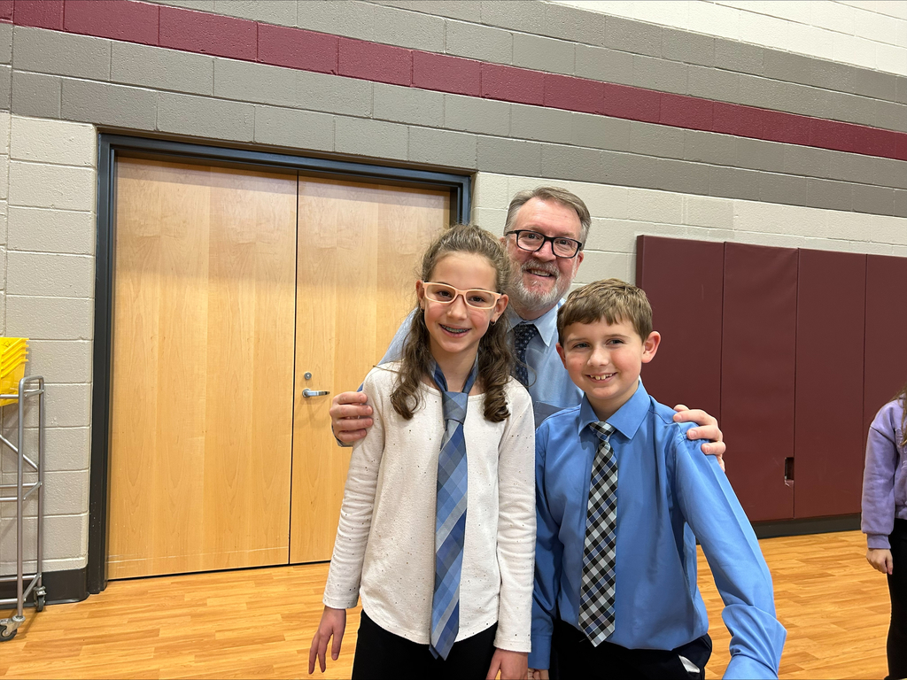 Students dressed in shirts and ties like their principal.