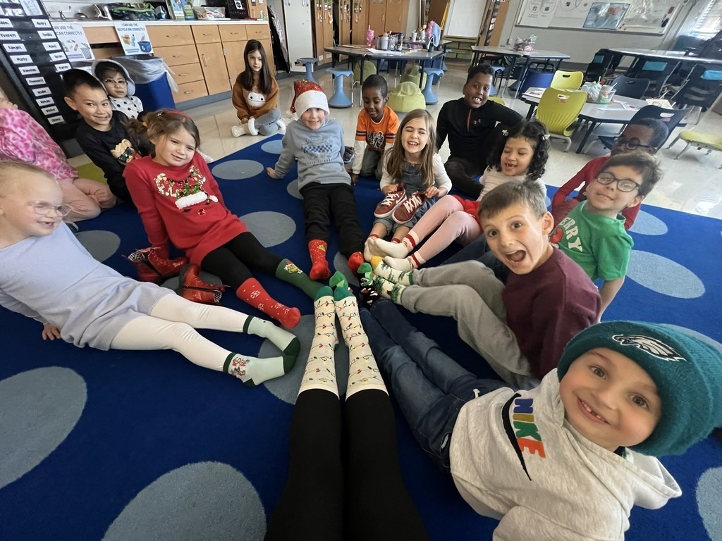 Students show off colorful socks.
