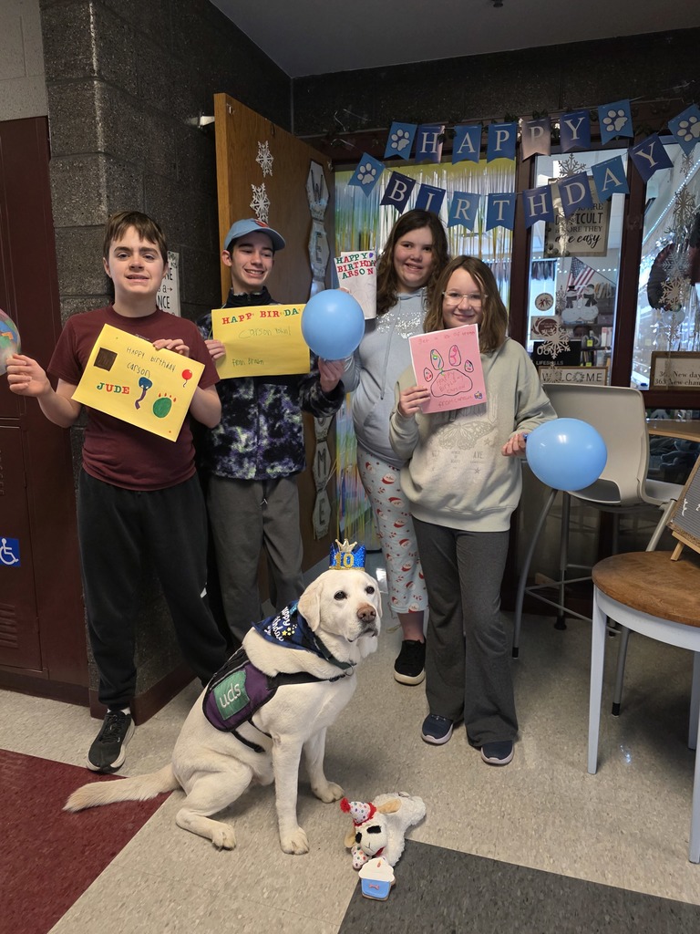 Students celebrate our facility dog's birthday.