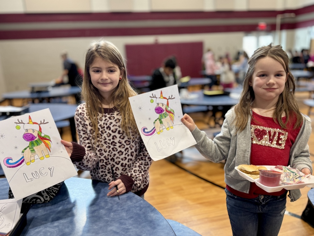 Two young students in the school cafeteria.