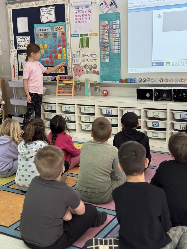 A student leading a lesson in math to her classmates.