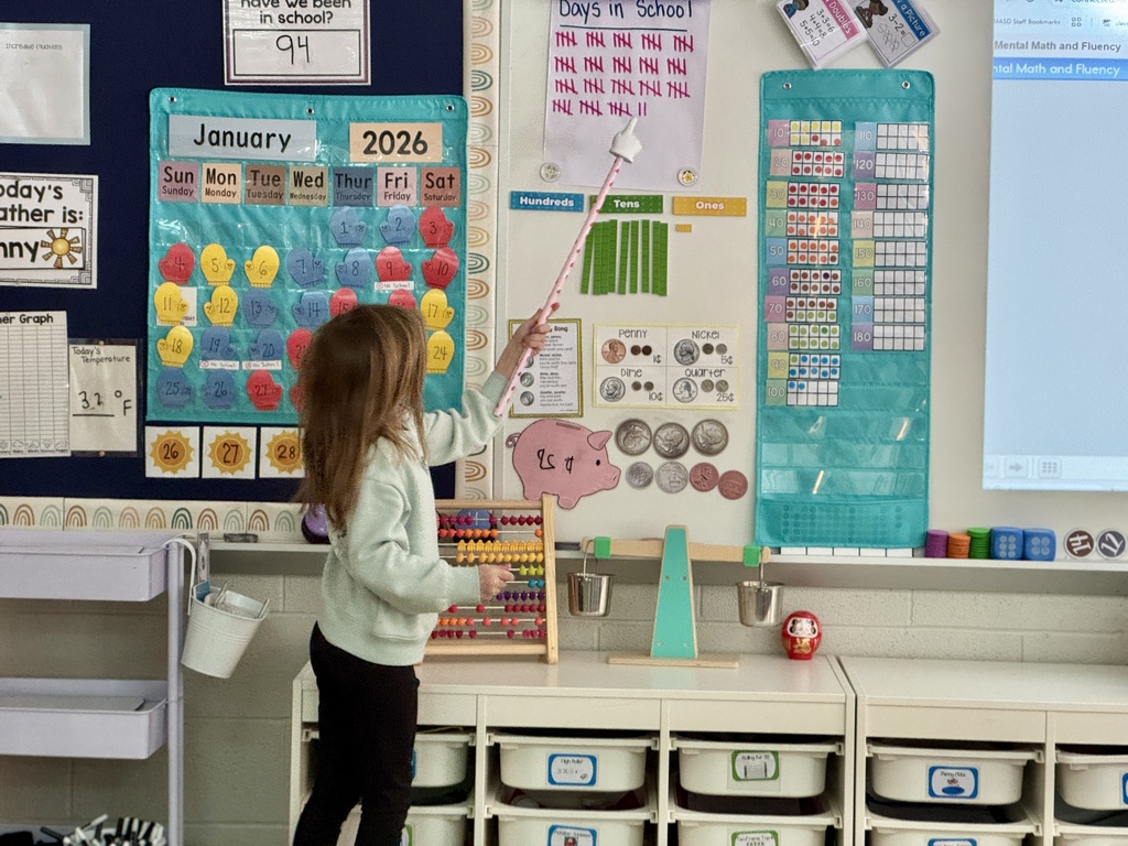 A student leading a lesson in math to her classmates.