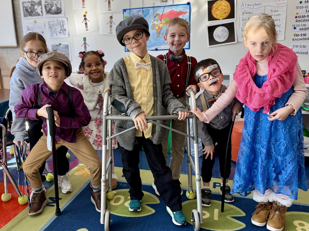 Young students dressed like they are 100 years old.