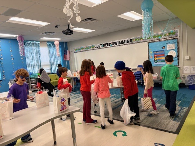 Students exchange valentine's cards.