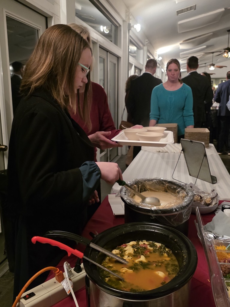 Students serve up homemade soup.
