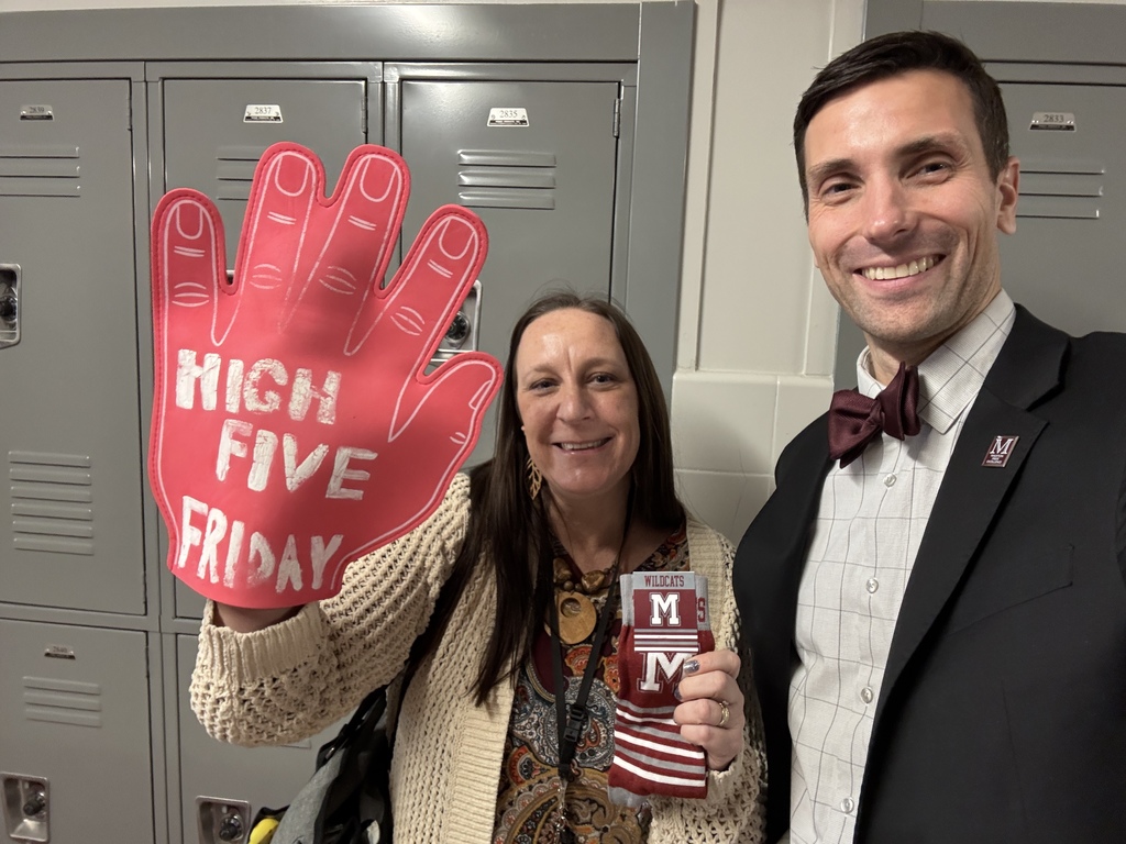 A man in a suit standing next to a woman with a cartoonized High Five Friday hand and a pair of branded socks.