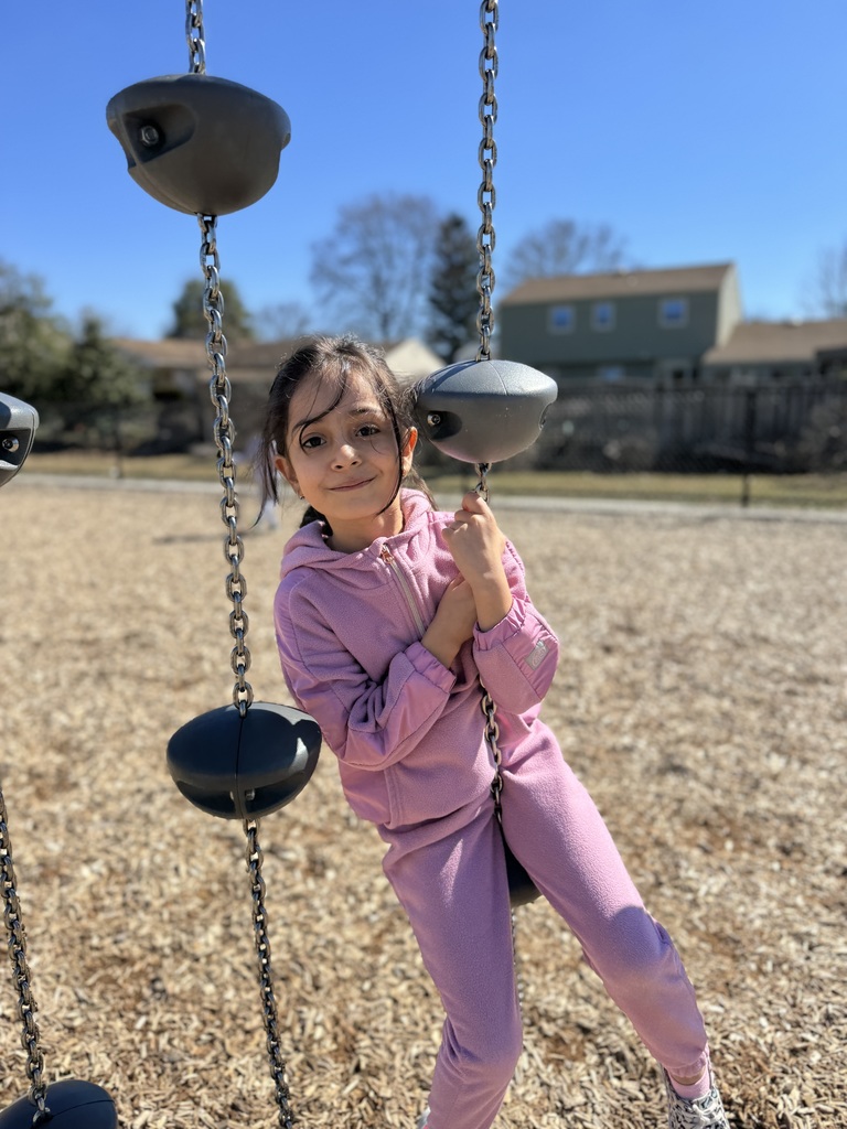 A young student on a school playground.