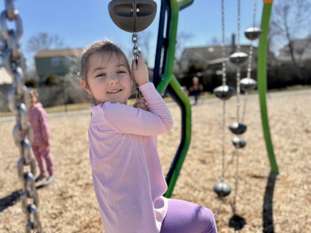 A young student on a school playground.