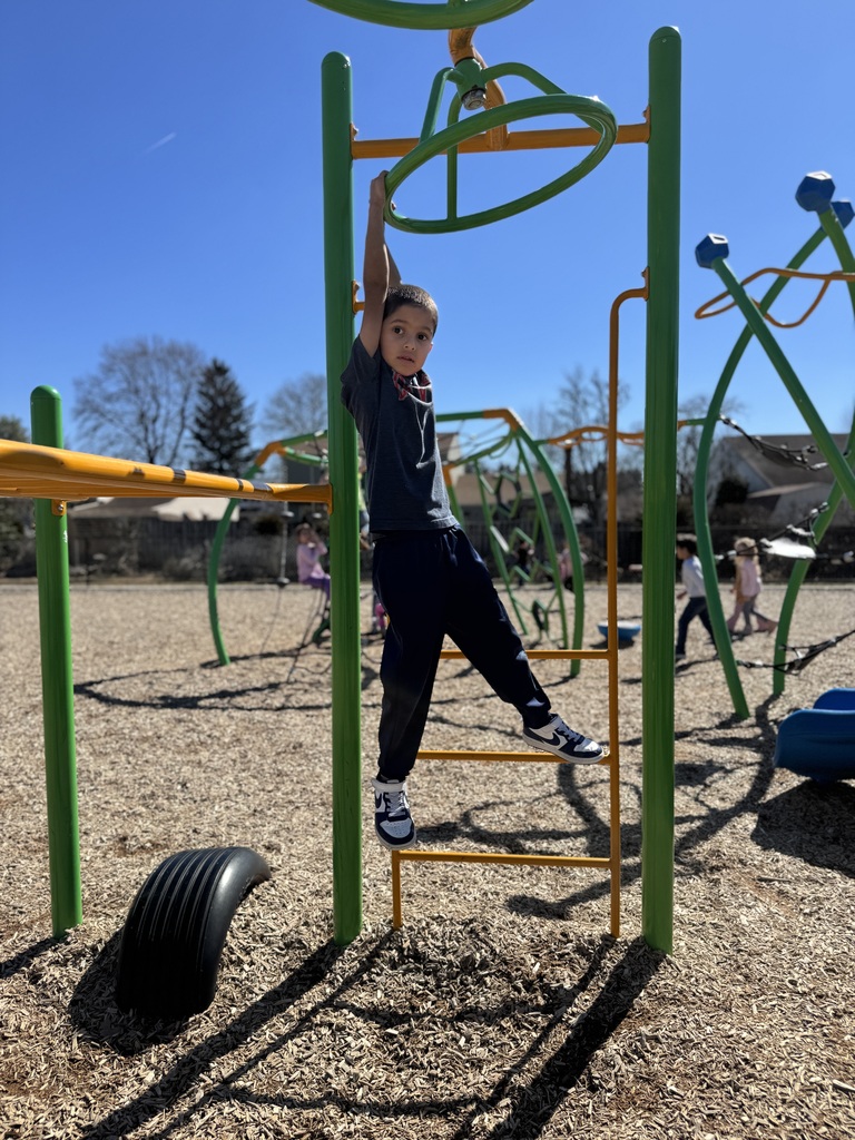 A young student on a school playground.