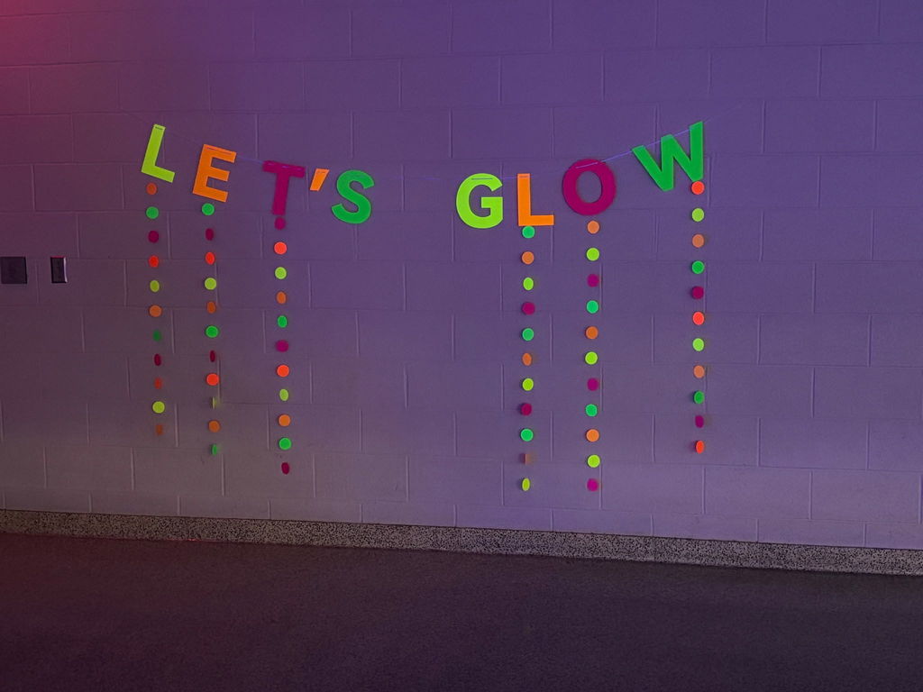 Dance decorations that say Let's Glow.