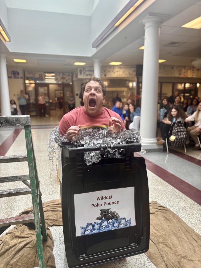 A man making a shocked face while plunging into ice cold water.