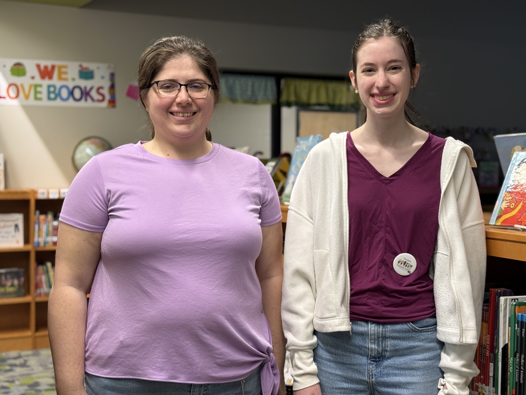 Two staff members in purple for Purple Up! day.