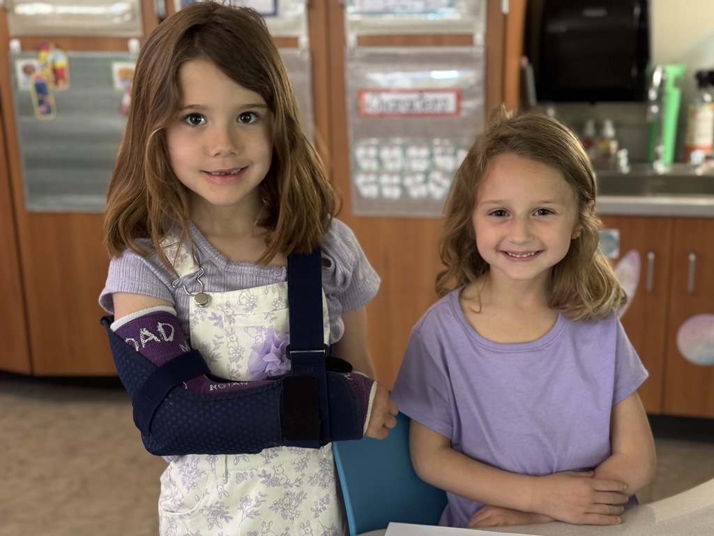 Two young students in purple for Purple Up! day.