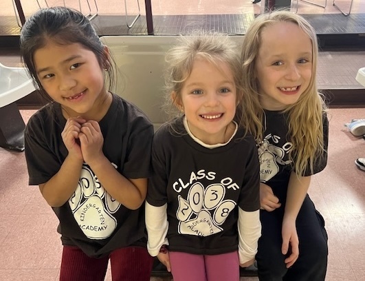 Friends smiling together for a photo.