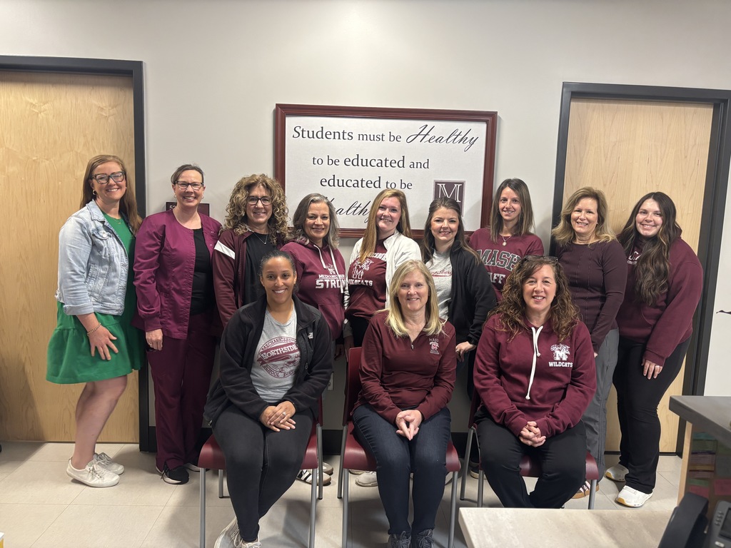 A group of school nurses posing for a photo.