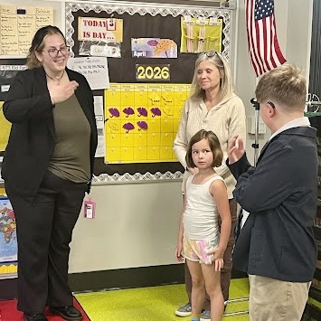 a sign language interpreter helps a student sign