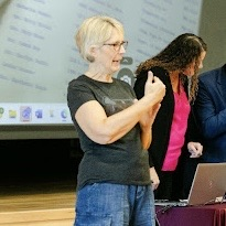 a closeup of a sign language interpreter