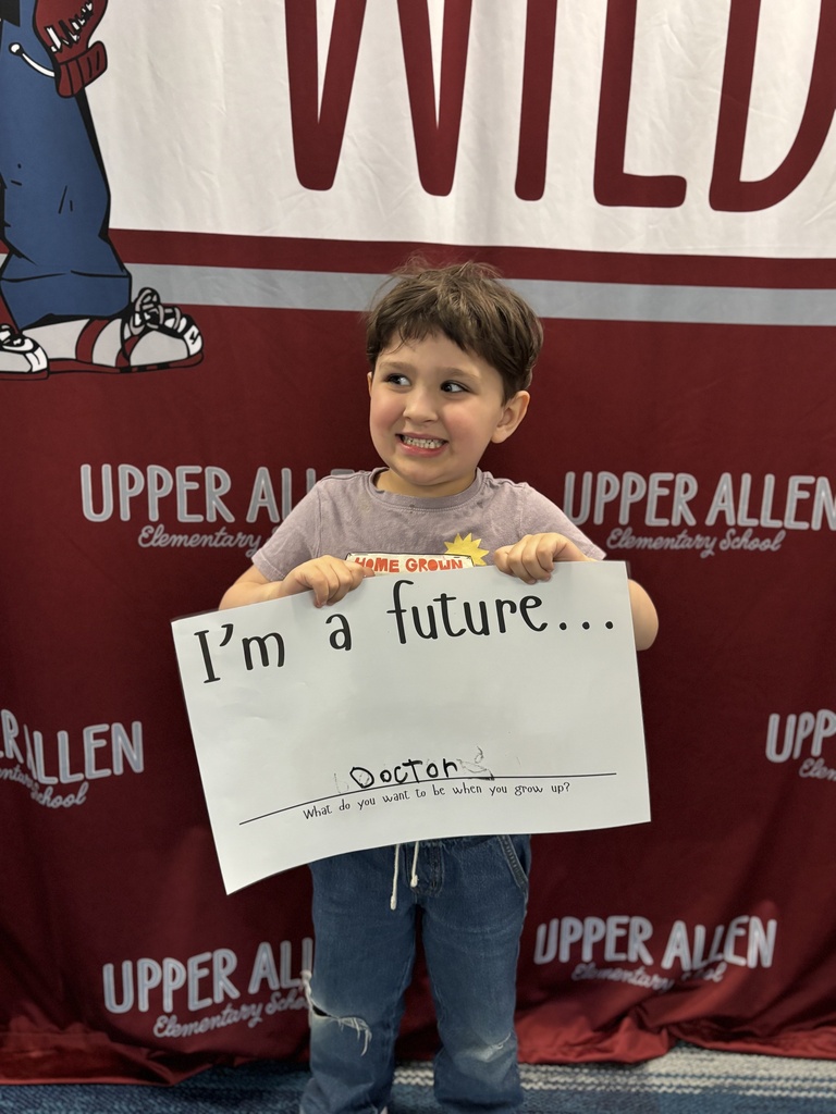 Young student holding a sign that says I'm a future doctor.