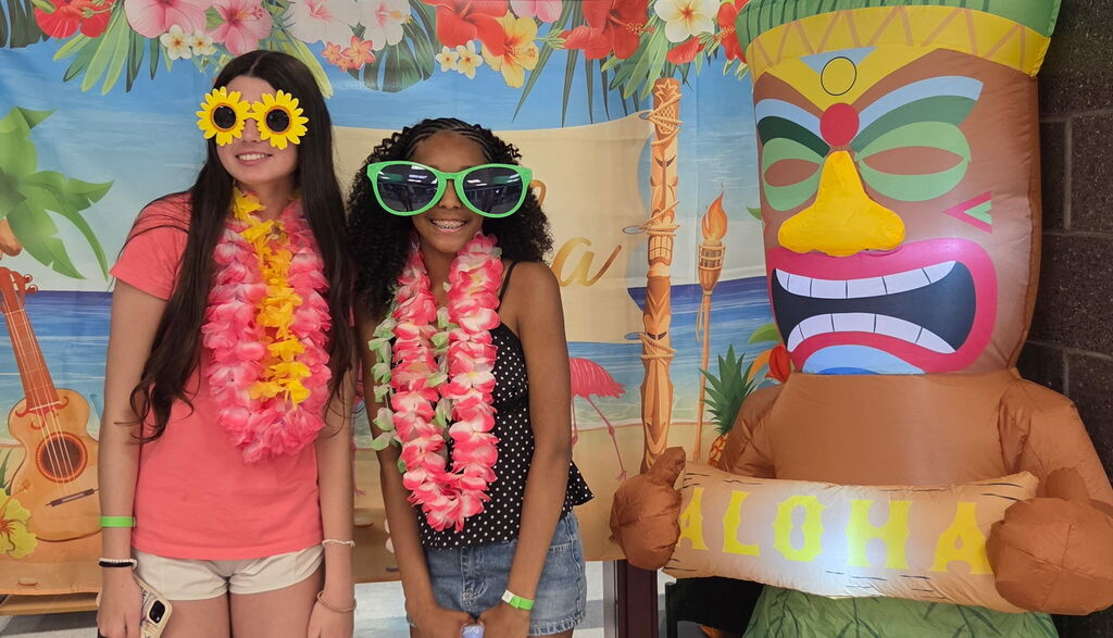 Students wearing oversized, silly sunglasses.