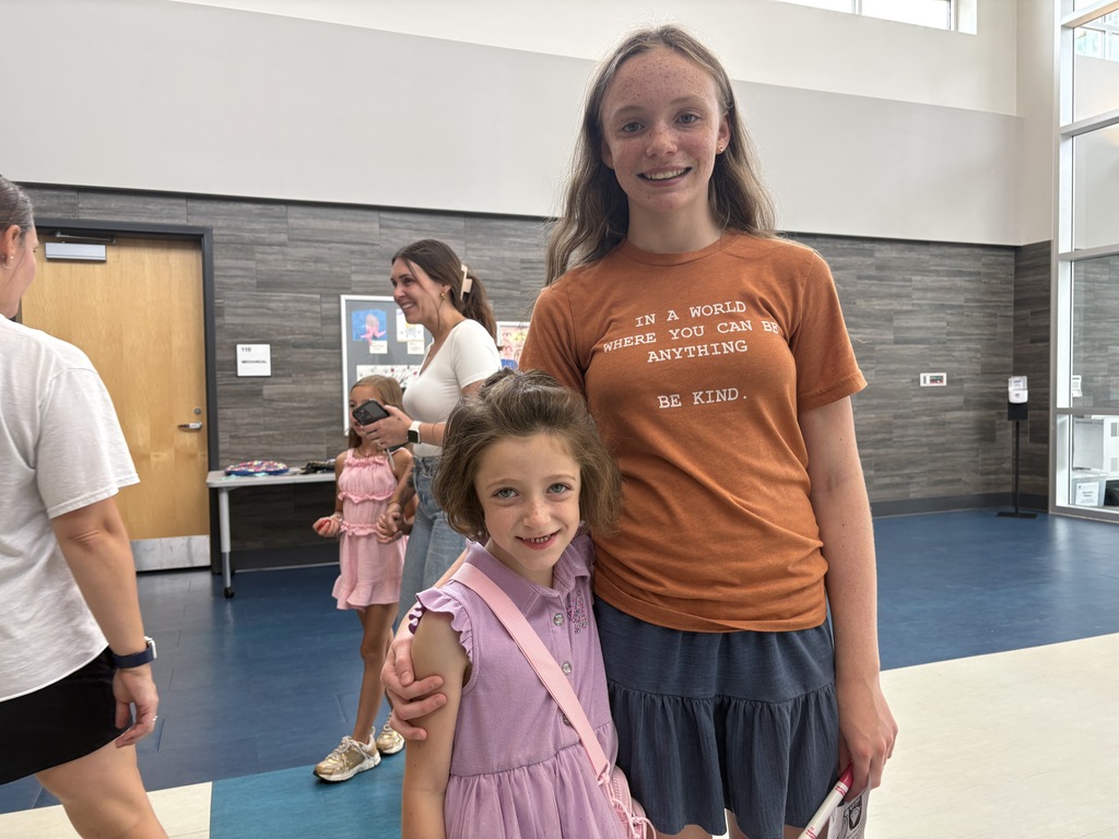 Families tour a school.