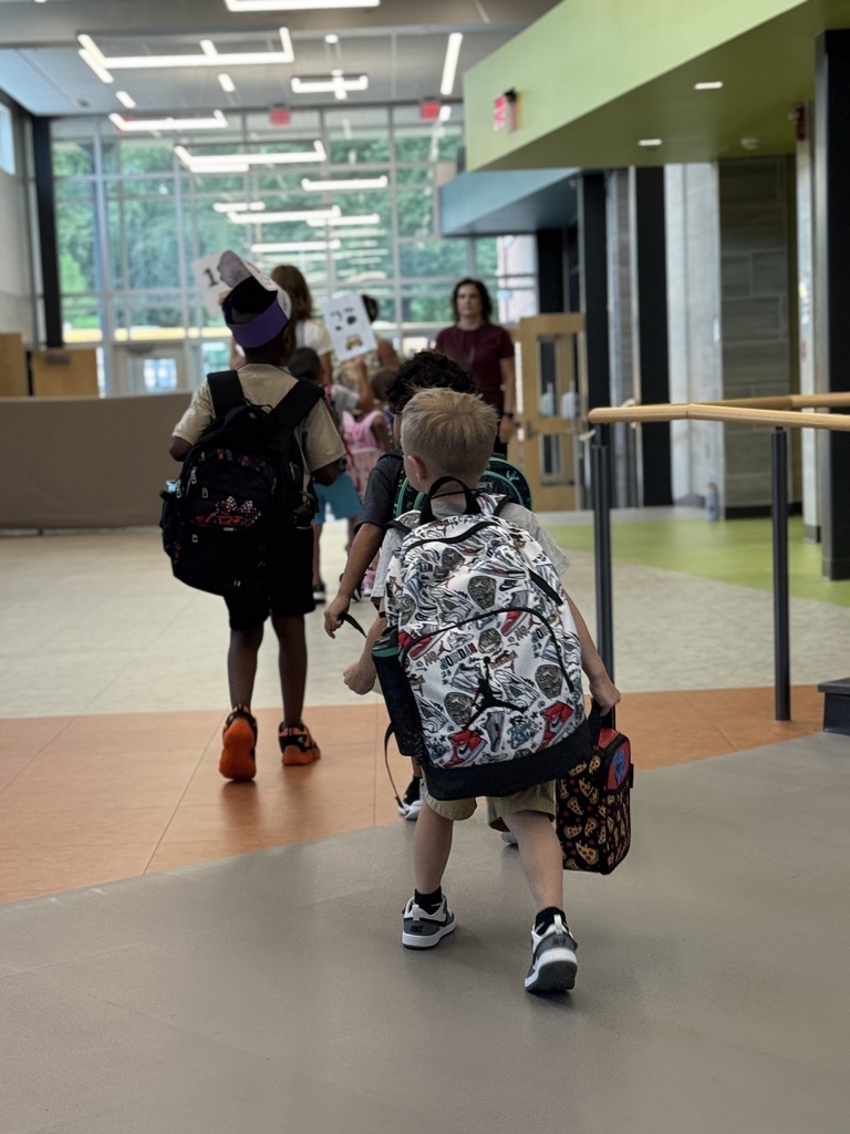 Students walking out of a school.