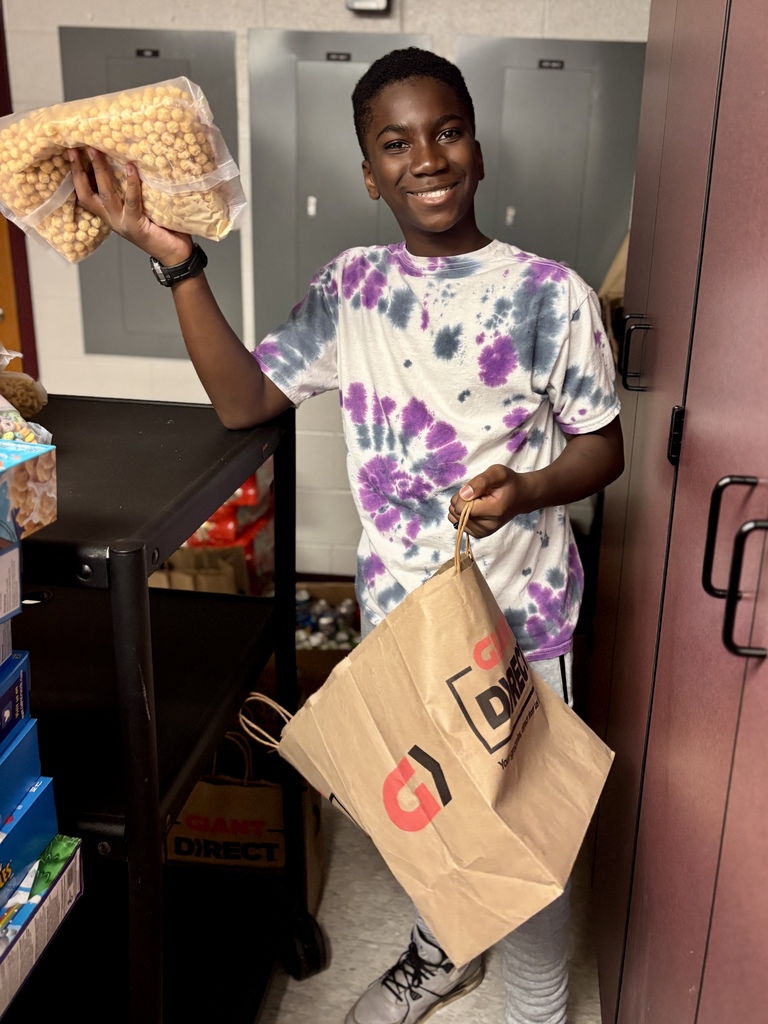 Students pack food bags.