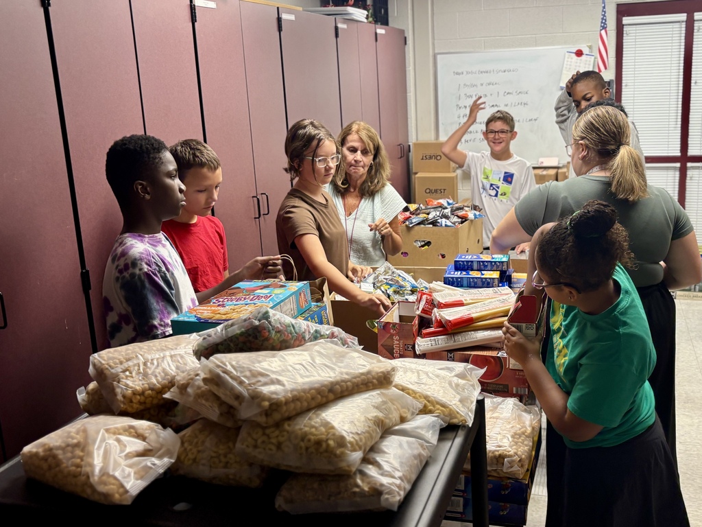Students pack food bags.