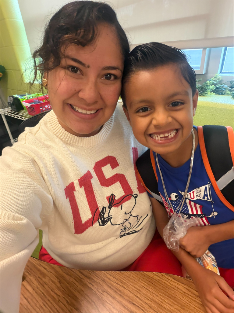 A teacher and student wear USA clothing.