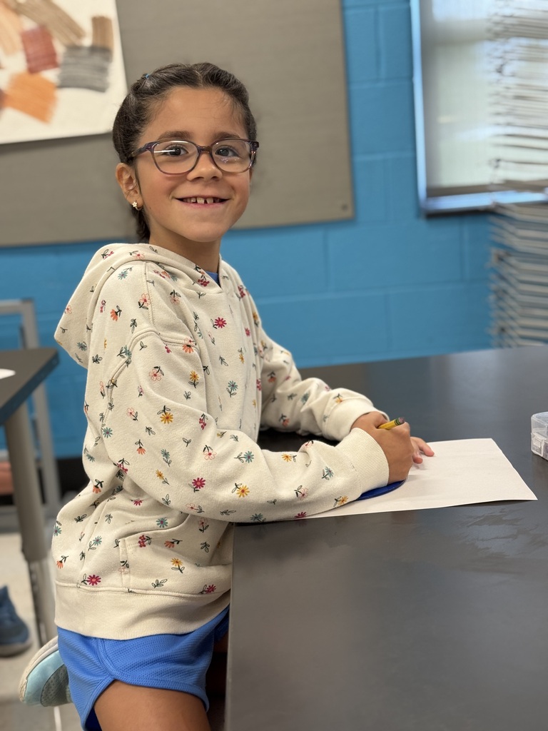 Students draw in art class.
