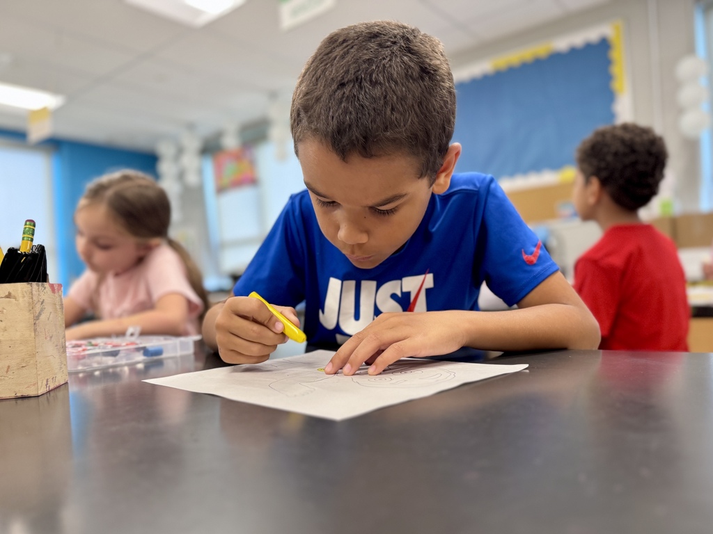 Students draw in art class.