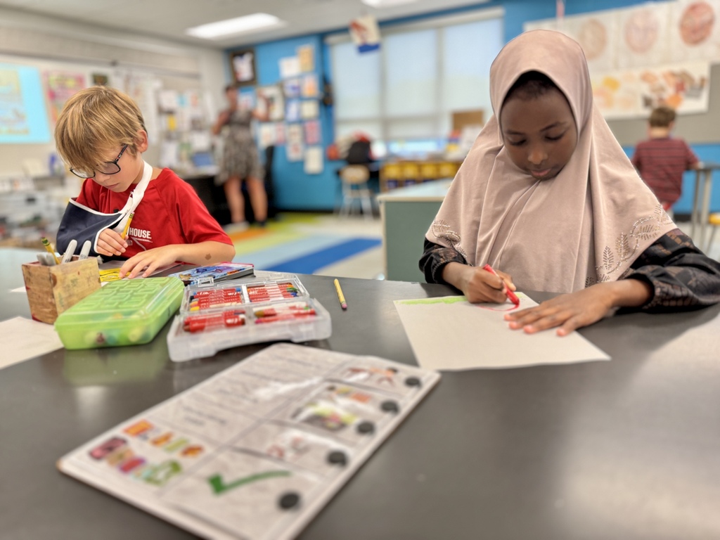 Students draw in art class.