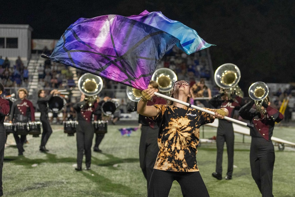 Color guard and performs during a halftime show.