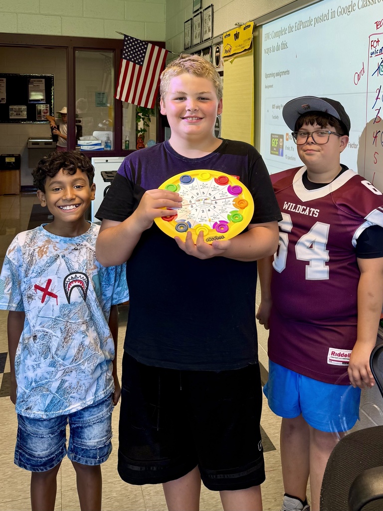 Students show off their math pallets, an interactive game.