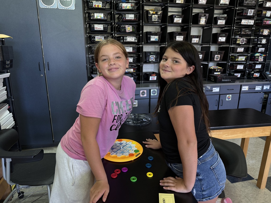 Two students practice math with an interactive game.
