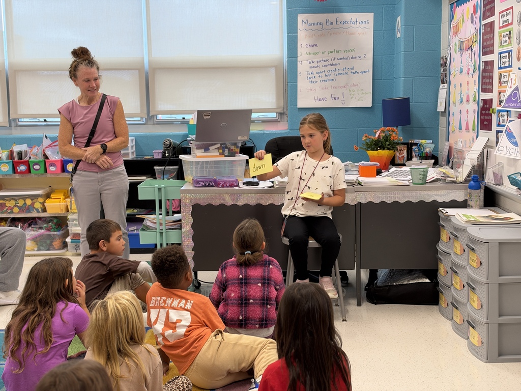 A student leads her classmates in a lesson on tricky words.