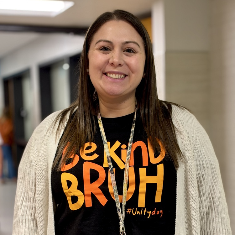 A principal wears a Be Kind Bruh shirt for Unity Day