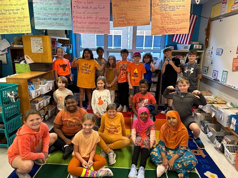 image of students wearing orange in classroom