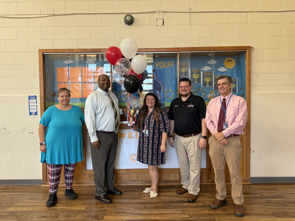 Principals accepting trophy